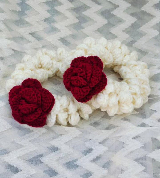 Maroon rose crochet scrunchies worn on wrist