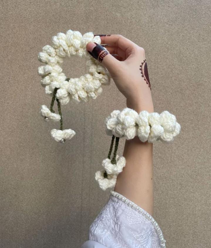 Maroon rose crochet bracelet worn on wrist